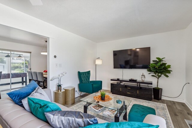 925 S Purdue Ave, Fresno, CA 93727 - living area featuring wood finished floors and baseboards