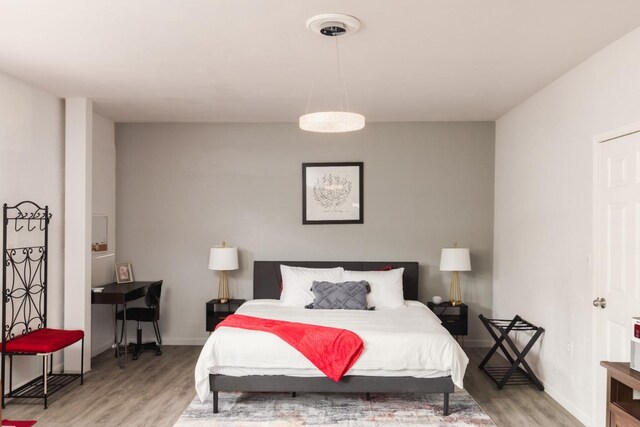 925 S Purdue Ave, Fresno, CA 93727 - bedroom featuring wood finished floors and baseboards