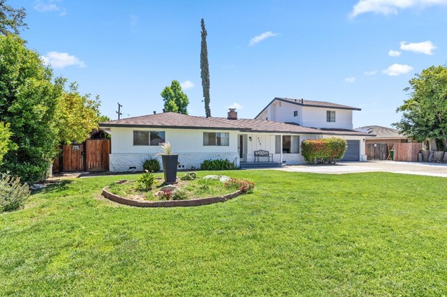 925 S Purdue Ave, Fresno, CA 93727 - view of front of house with driveway, brick siding, a chimney, and an attached garage