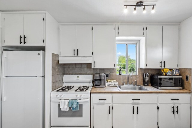 925 S Purdue Ave, Fresno, CA 93727 - kitchen featuring white appliances, under cabinet range hood, a sink, white cabinetry, and light countertops