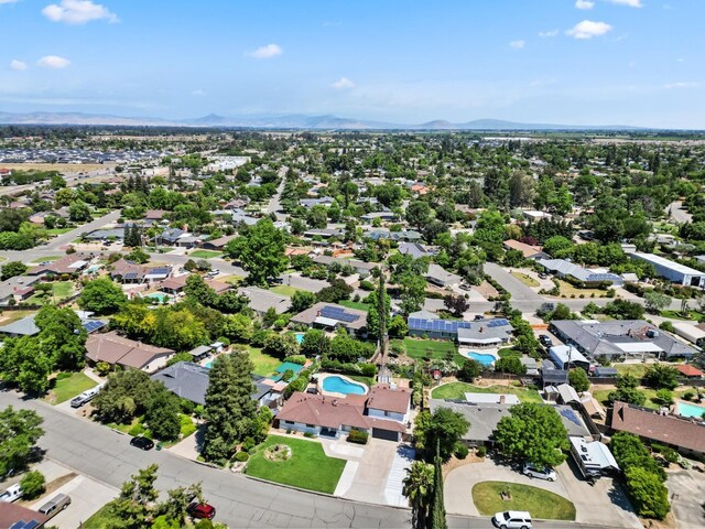 925 S Purdue Ave, Fresno, CA 93727 - aerial view of residential area featuring a pool and a mountain backdrop
