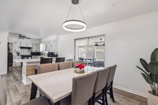 925 S Purdue Ave, Fresno, CA 93727 - dining space with light wood-style floors, baseboards, and ceiling fan