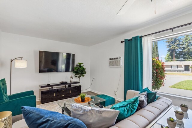 925 S Purdue Ave, Fresno, CA 93727 - living room featuring an AC wall unit and baseboards