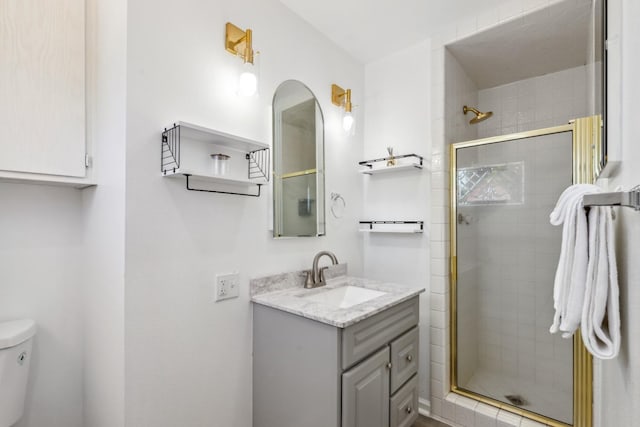 925 S Purdue Ave, Fresno, CA 93727 - full bathroom featuring toilet, vanity, and a stall shower