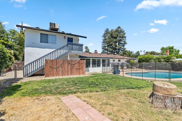 925 S Purdue Ave, Fresno, CA 93727 - rear view of house with stairs, central air condition unit, and stucco siding
