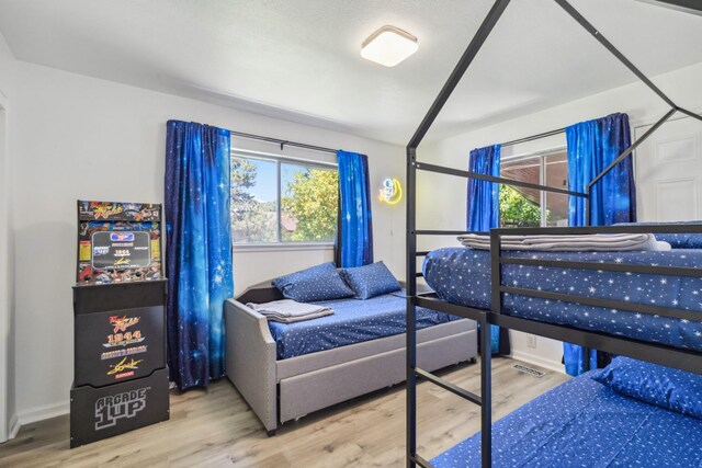 925 S Purdue Ave, Fresno, CA 93727 - bedroom featuring wood finished floors and multiple windows