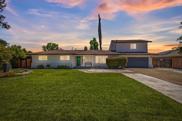 925 S Purdue Ave, Fresno, CA 93727 - view of front facade with driveway, a garage, and brick siding