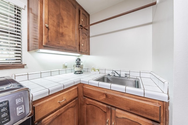 kitchen with stove and tile counters