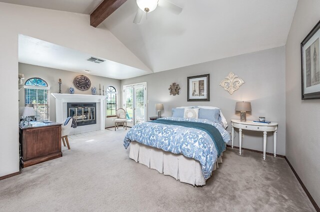 bedroom with vaulted ceiling with beams, ceiling fan, and carpet floors