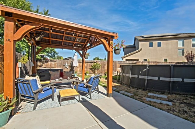 view of terrace featuring an outdoor living space, a swimming pool, and a gazebo