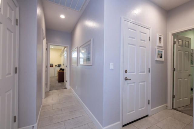 hallway with light tile floors