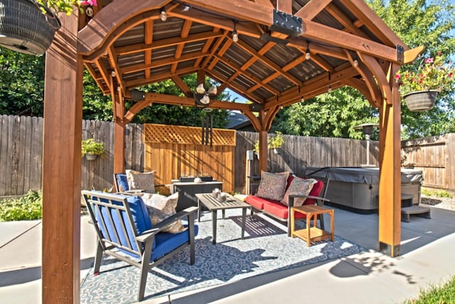 view of patio featuring outdoor lounge area and a gazebo