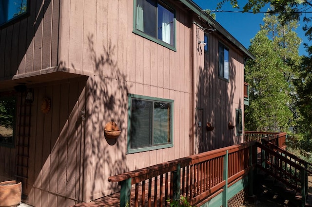 view of property exterior featuring a deck