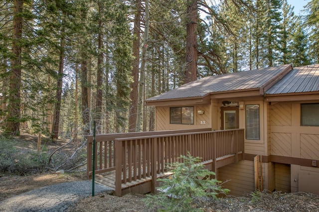 view of side of home with a wooden deck