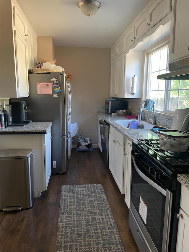 kitchen featuring white cabinetry, sink, dark wood-type flooring, and stainless steel appliances