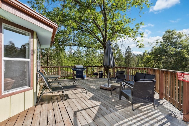 wooden deck featuring grilling area