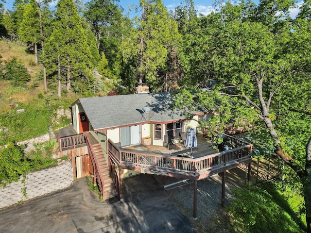 rear view of house featuring a deck