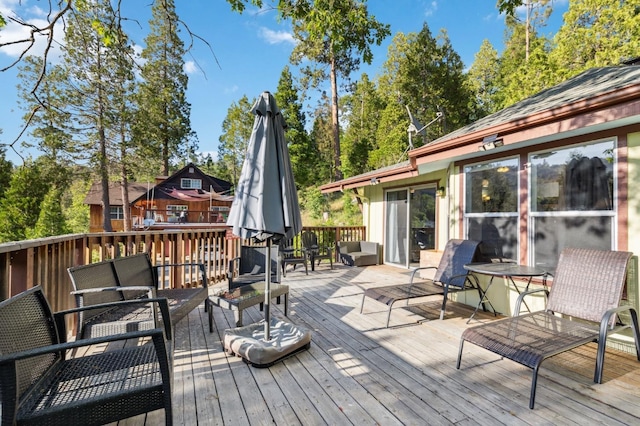 wooden terrace featuring an outdoor living space