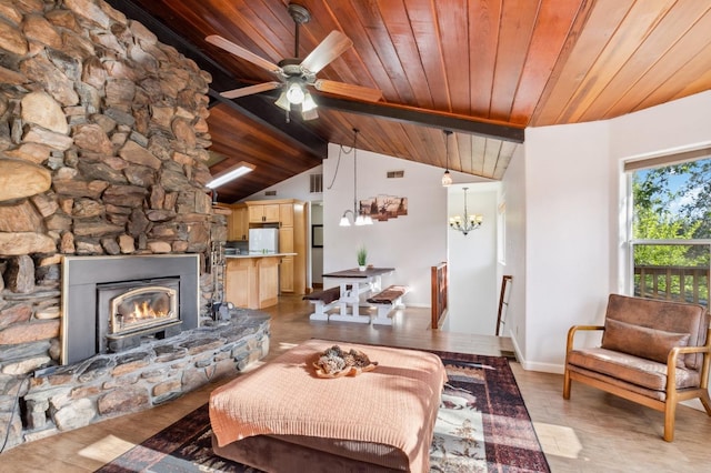 living room with wood ceiling, ceiling fan with notable chandelier, lofted ceiling, a fireplace, and light hardwood / wood-style flooring