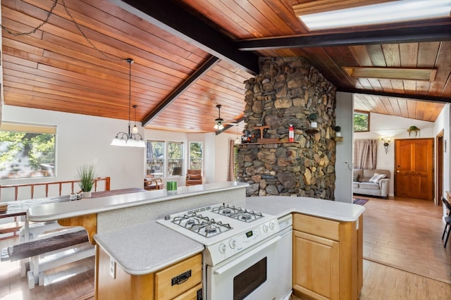 kitchen featuring white gas range, wood ceiling, open floor plan, lofted ceiling with beams, and light countertops