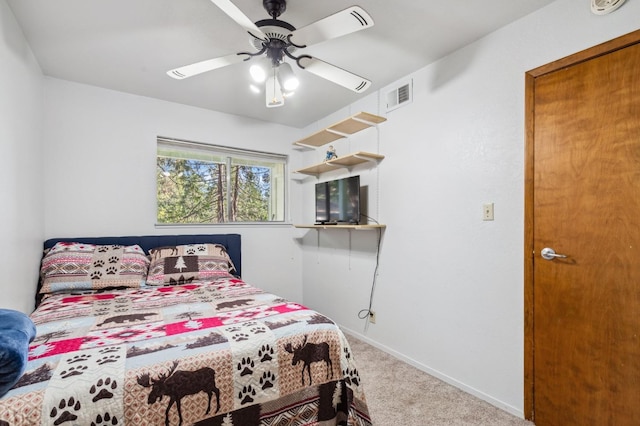 carpeted bedroom featuring ceiling fan