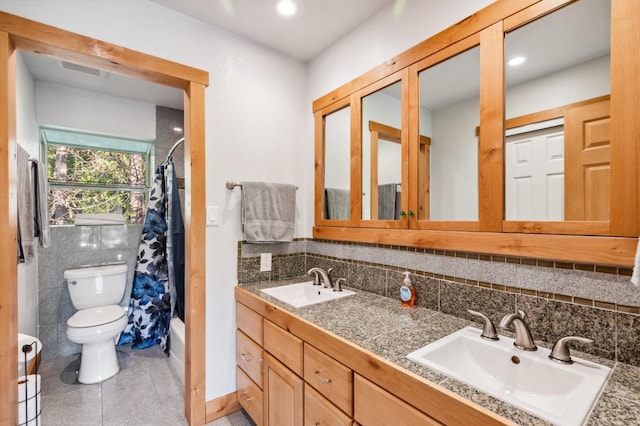 full bathroom with vanity, tasteful backsplash, tile patterned floors, toilet, and shower / tub combo with curtain