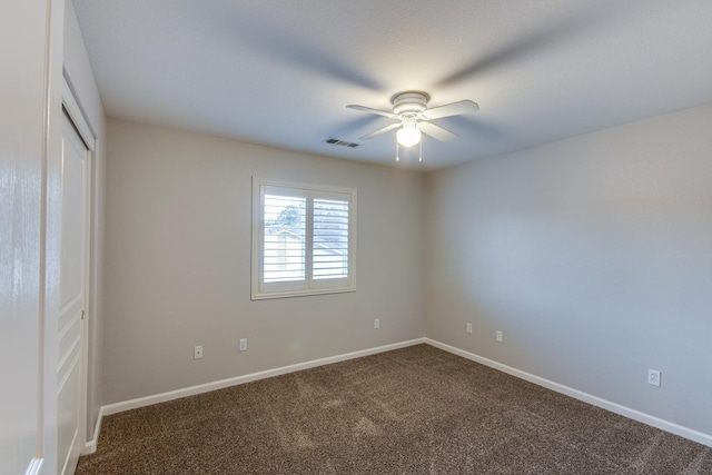 unfurnished bedroom featuring carpet, ceiling fan, and a closet