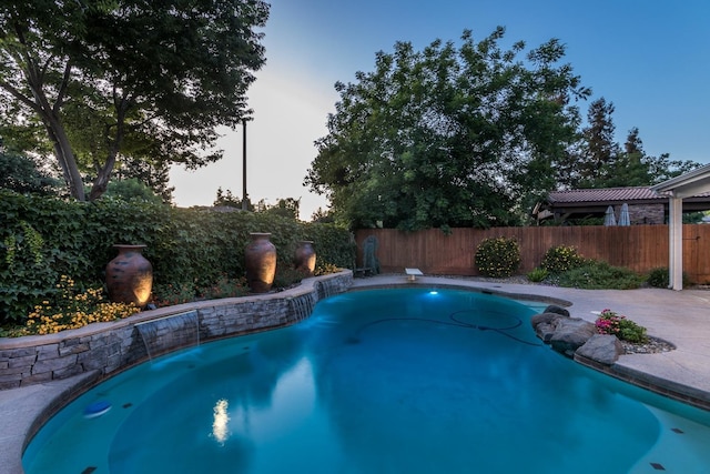 pool at dusk with a diving board