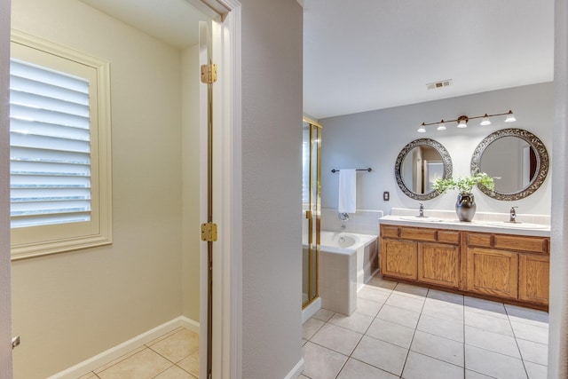 bathroom featuring tile patterned flooring, vanity, and plus walk in shower