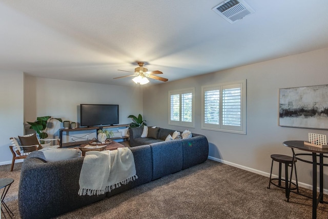 living room with ceiling fan and carpet floors