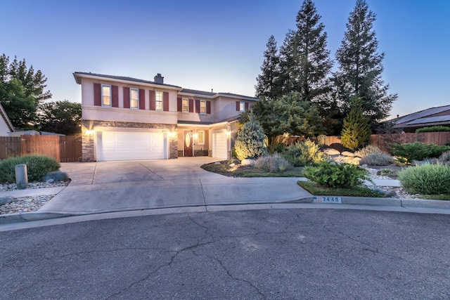 front of property with a garage