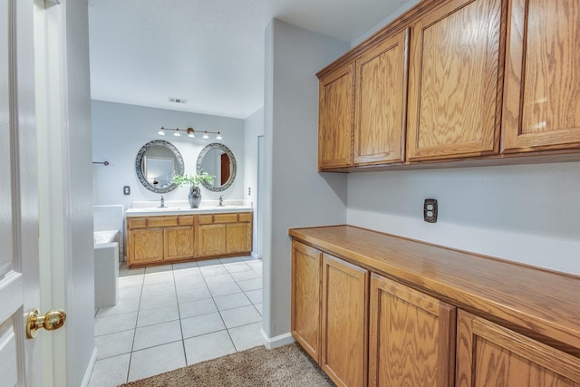 interior space with vanity and tile patterned flooring