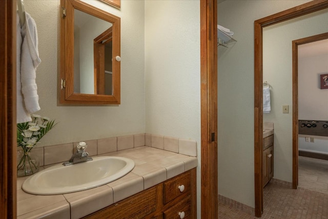 bathroom featuring tile floors and vanity