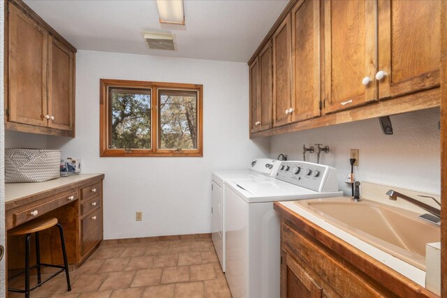 laundry room featuring independent washer and dryer, washer hookup, light tile floors, sink, and cabinets