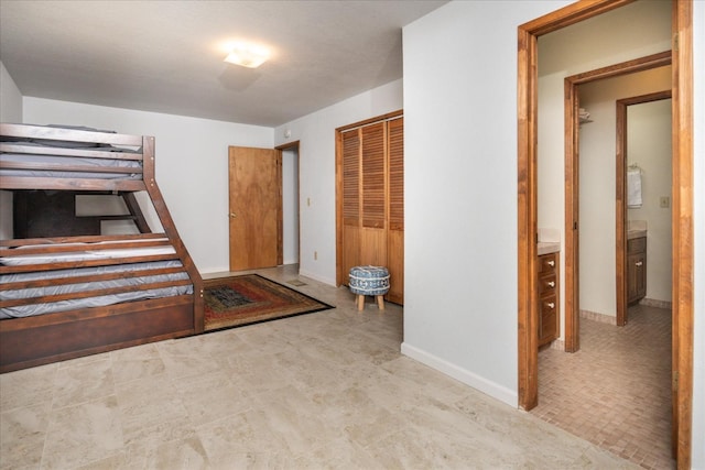 unfurnished bedroom featuring tile floors and a closet