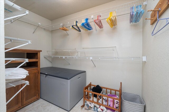 washroom with light tile flooring