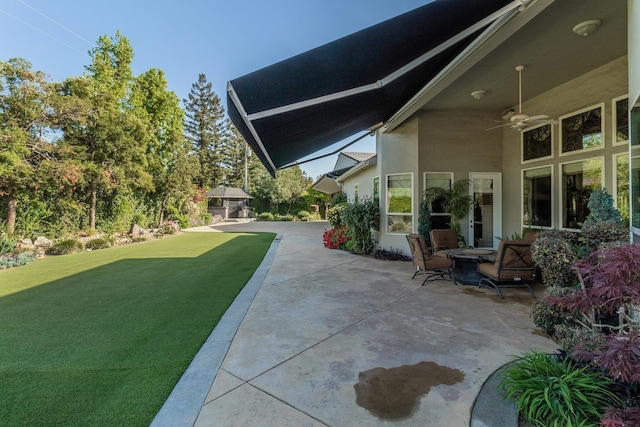 view of patio / terrace featuring ceiling fan