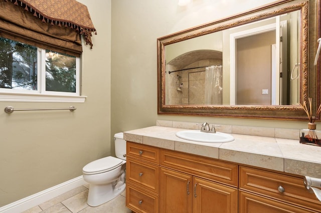 full bathroom featuring a shower with curtain, toilet, vanity, tile patterned flooring, and baseboards