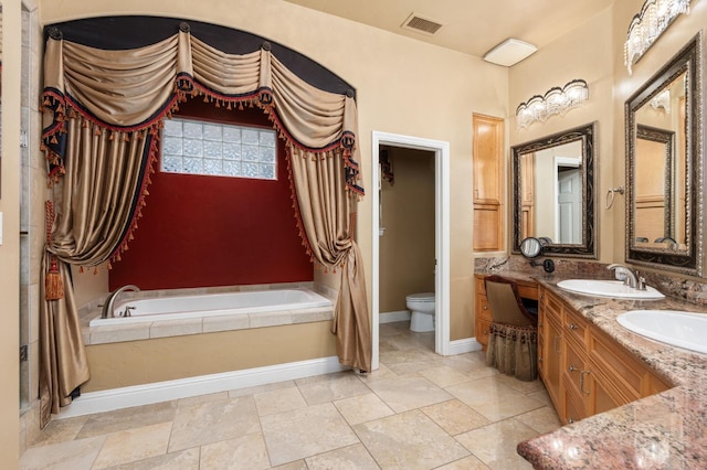 full bath featuring double vanity, visible vents, toilet, a bath, and a sink