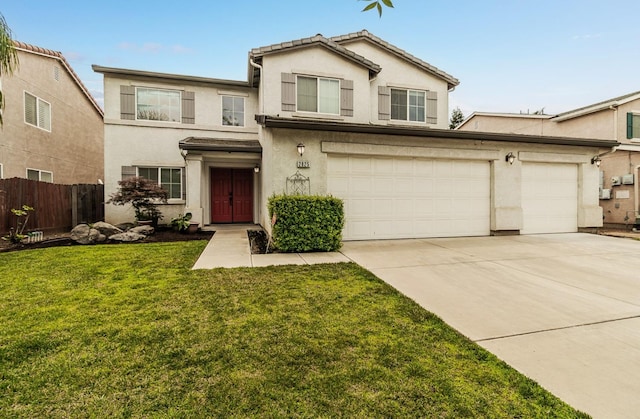 view of front of home featuring a front lawn and a garage