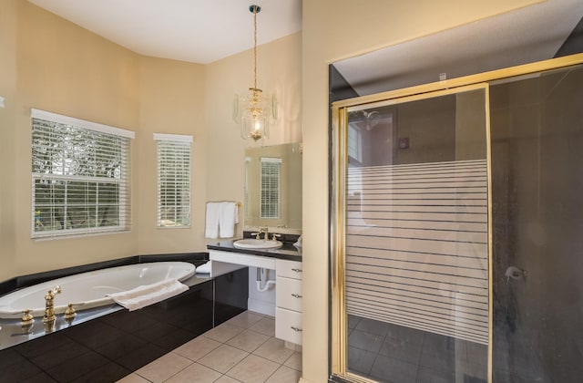 bathroom featuring shower with separate bathtub, vanity, and tile floors