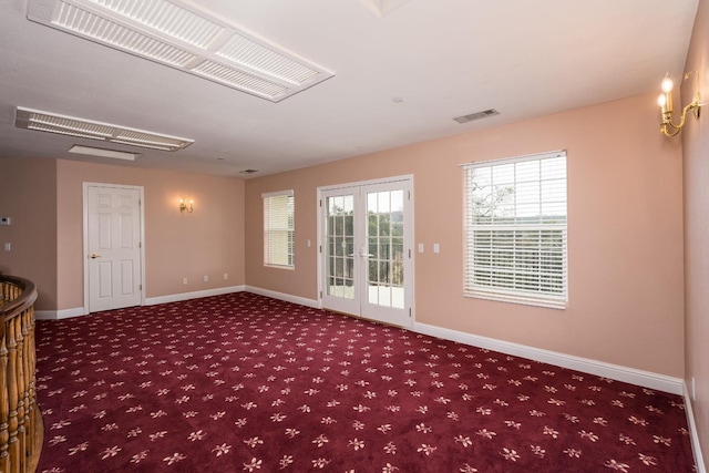 empty room with carpet floors and french doors