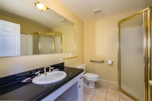 bathroom featuring tile floors, walk in shower, oversized vanity, and toilet