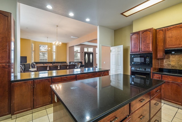 kitchen featuring black appliances, light tile flooring, and a kitchen island