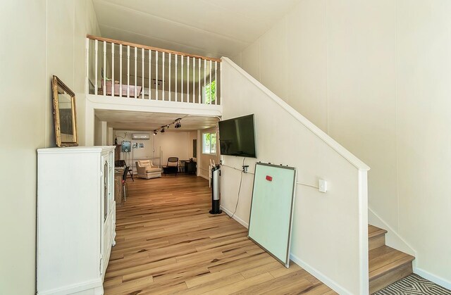 staircase featuring hardwood / wood-style floors