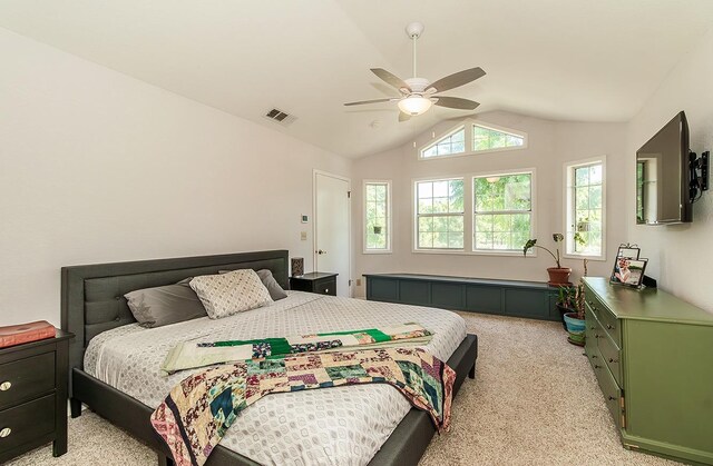 bedroom with light colored carpet, ceiling fan, and lofted ceiling