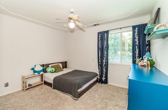 bedroom featuring ceiling fan and light carpet