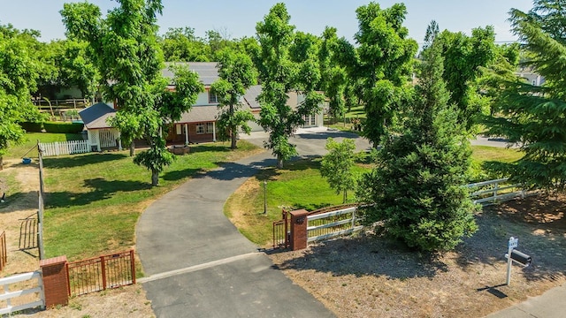 view of property's community with a lawn