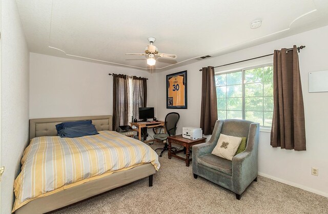 carpeted bedroom with ceiling fan