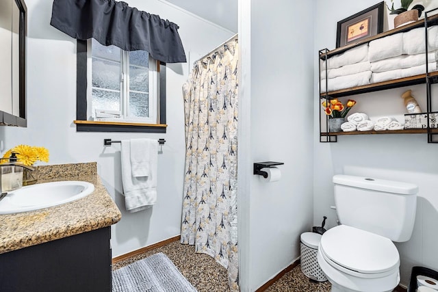 bathroom with a shower with shower curtain, vanity, and toilet